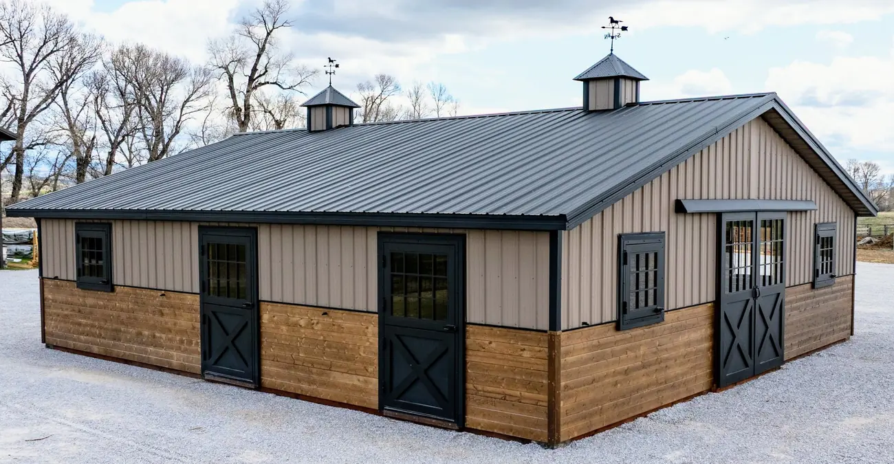34×36 two-piece horse barn exterior, buckskin siding and black metal roof